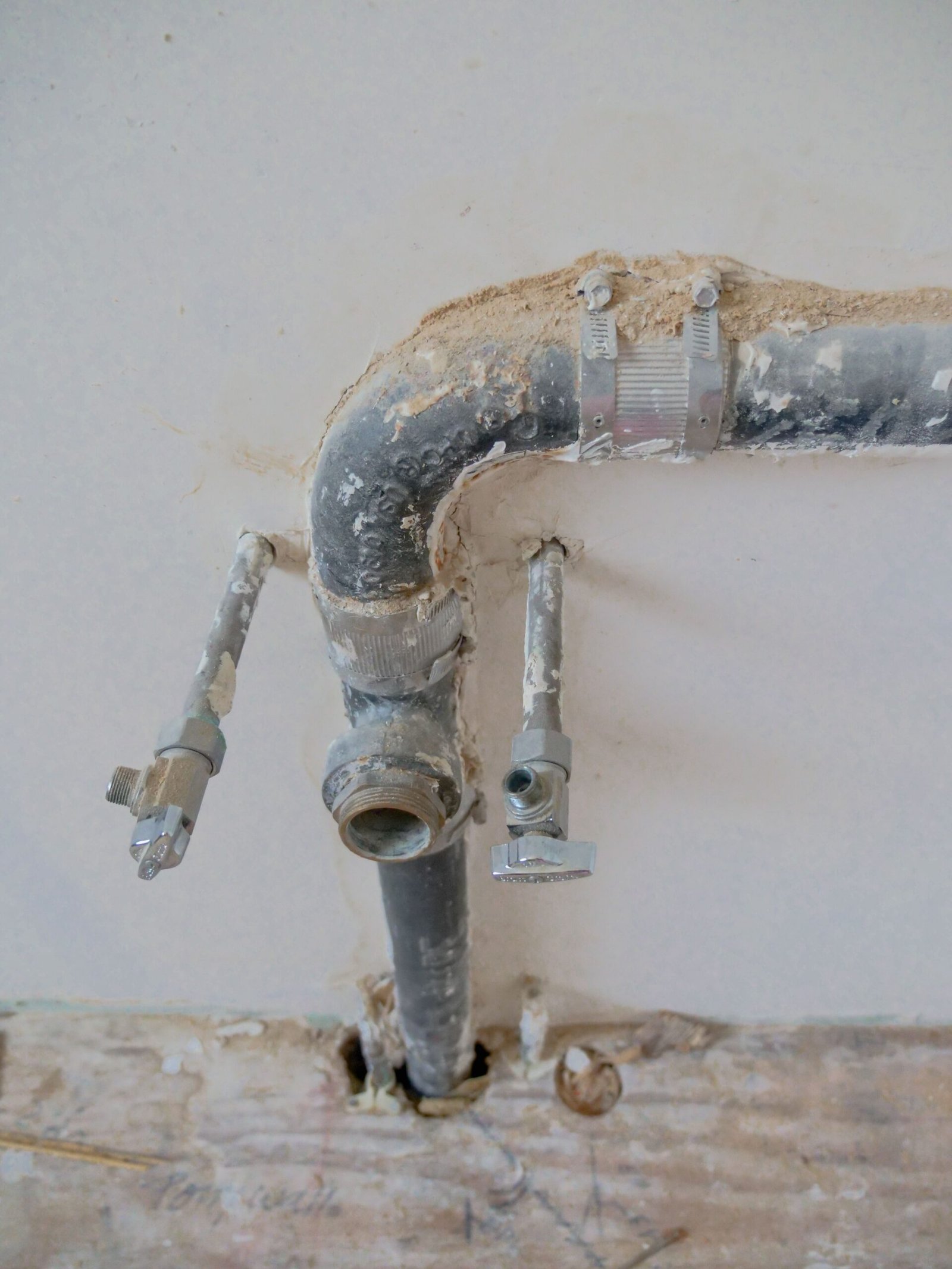 Exposed damaged pipe fitting behind a wall, Los Angeles CA