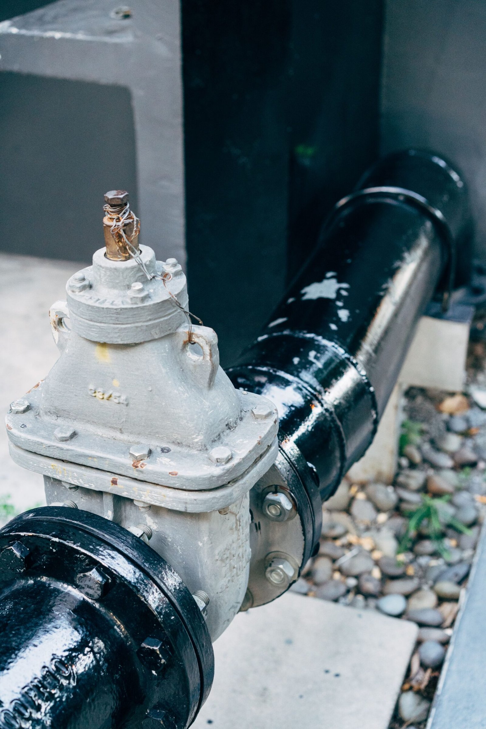 Close-up of a water shutoff valve and pipe fitting, Los Angeles CA