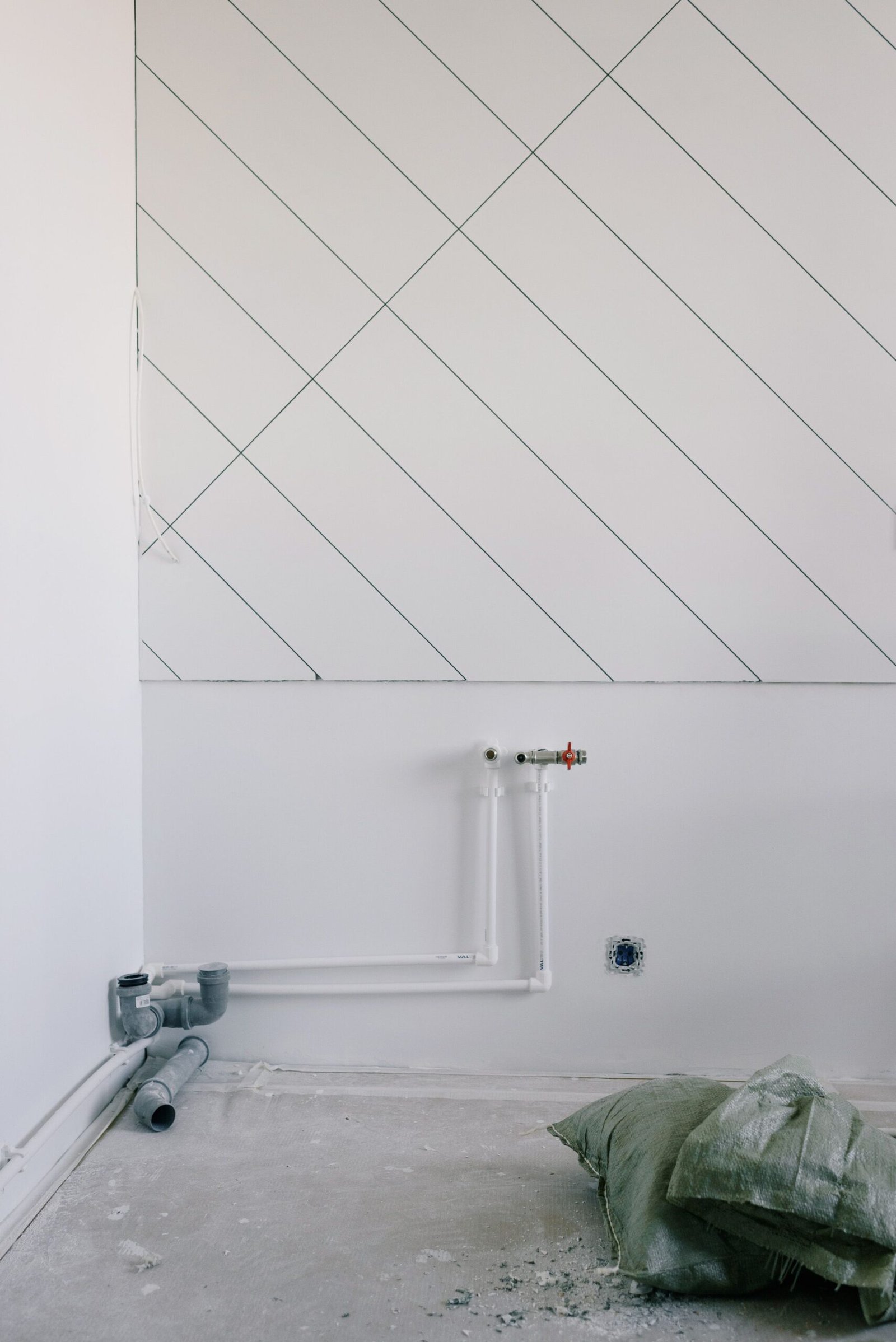 Fresh rough-in plumbing pipework installed along a wall, Los Angeles CA